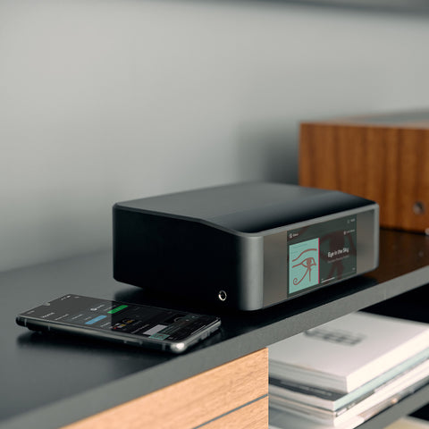 Bluesound Node Icon on a Credenza with a phone