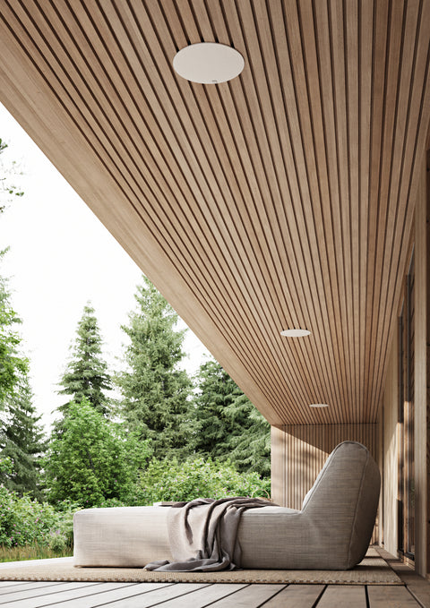 DALI Phantom E-80 Weather Resistant In Ceiling Speaker with grille installed over covered deck
