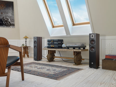 DALI Oberon 5 Dark Walnut without grilles in a stereo setup in a listening room