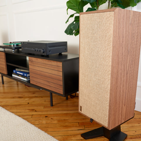 PSB Passif Tower Speaker in living room beside a credenza