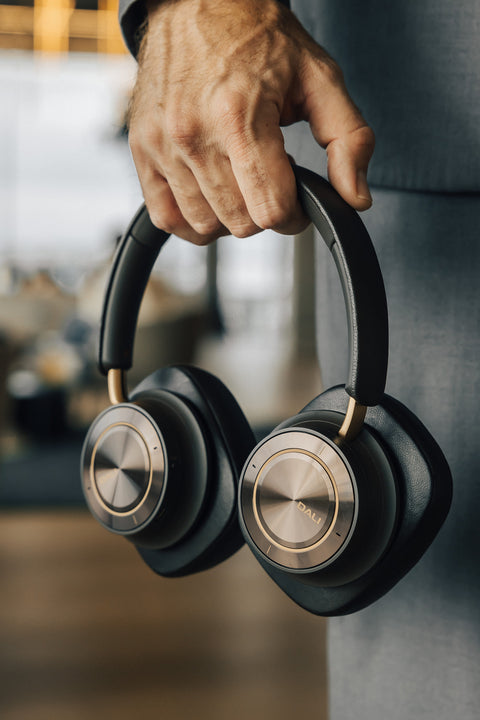 DALI IO-12 Headphones in a person's hand