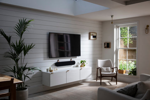 DALI Katch One Soundbar Iron Black wall mounted below a TV