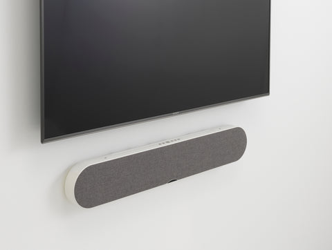 DALI Katch One Soundbar Mountain White wall mounted below a TV