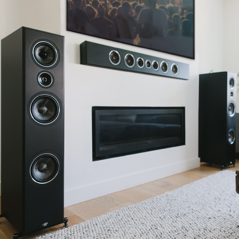 PSB Imagine T65 Tower Speakers Black with PSB PWM3 black as center channel in a living room home theatre setup
